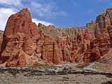 Mustang 03 04-4 Drakmar Red Cliffs The trail goes along the base of the cliffs from Lower Drakmar to Upper Drakmar in about 20 minutes, with more colourful red cliffs.